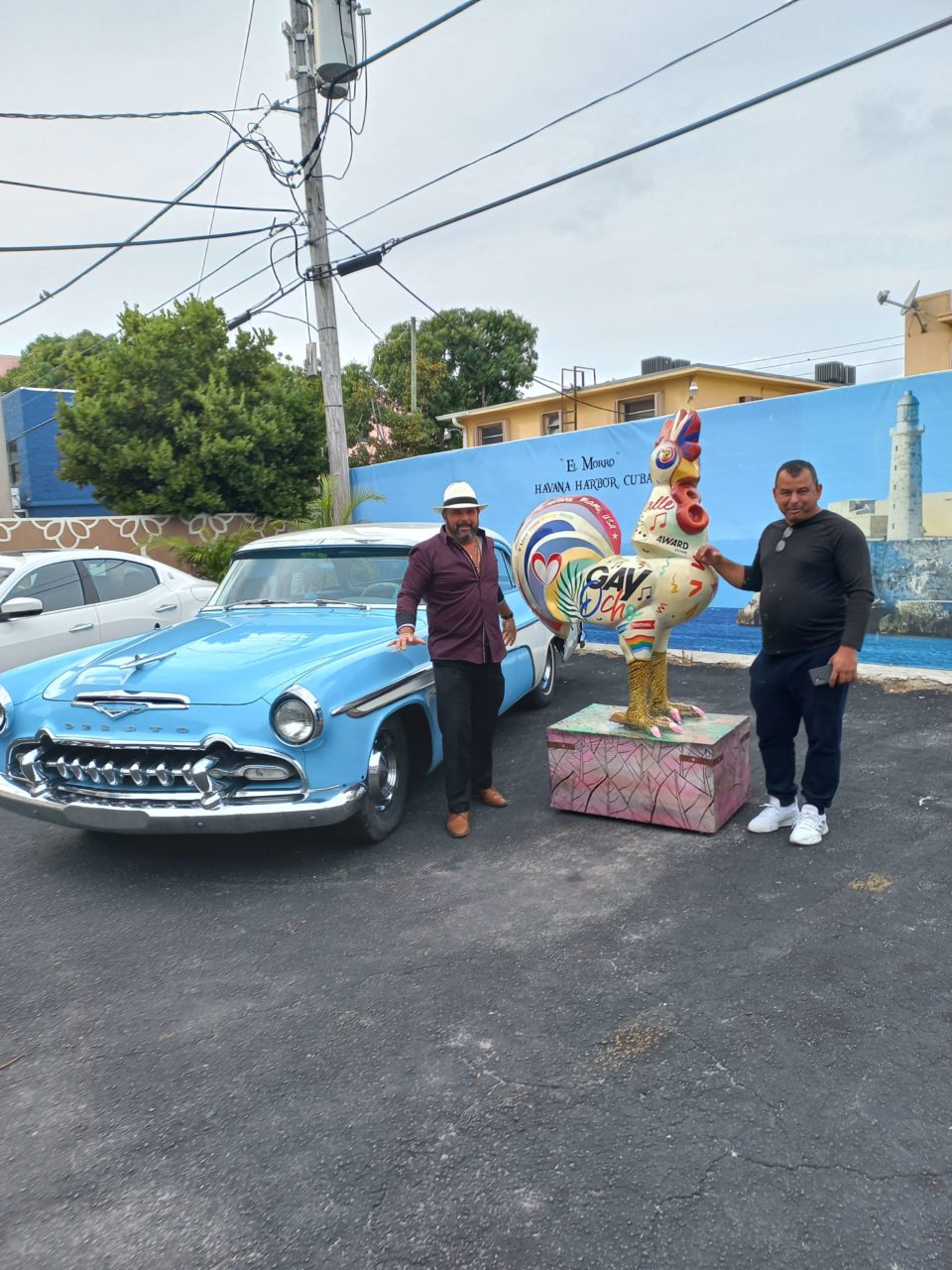 Pedro Bello and Fidel D. Asis con el Gallo Oficial de el festival Gay8