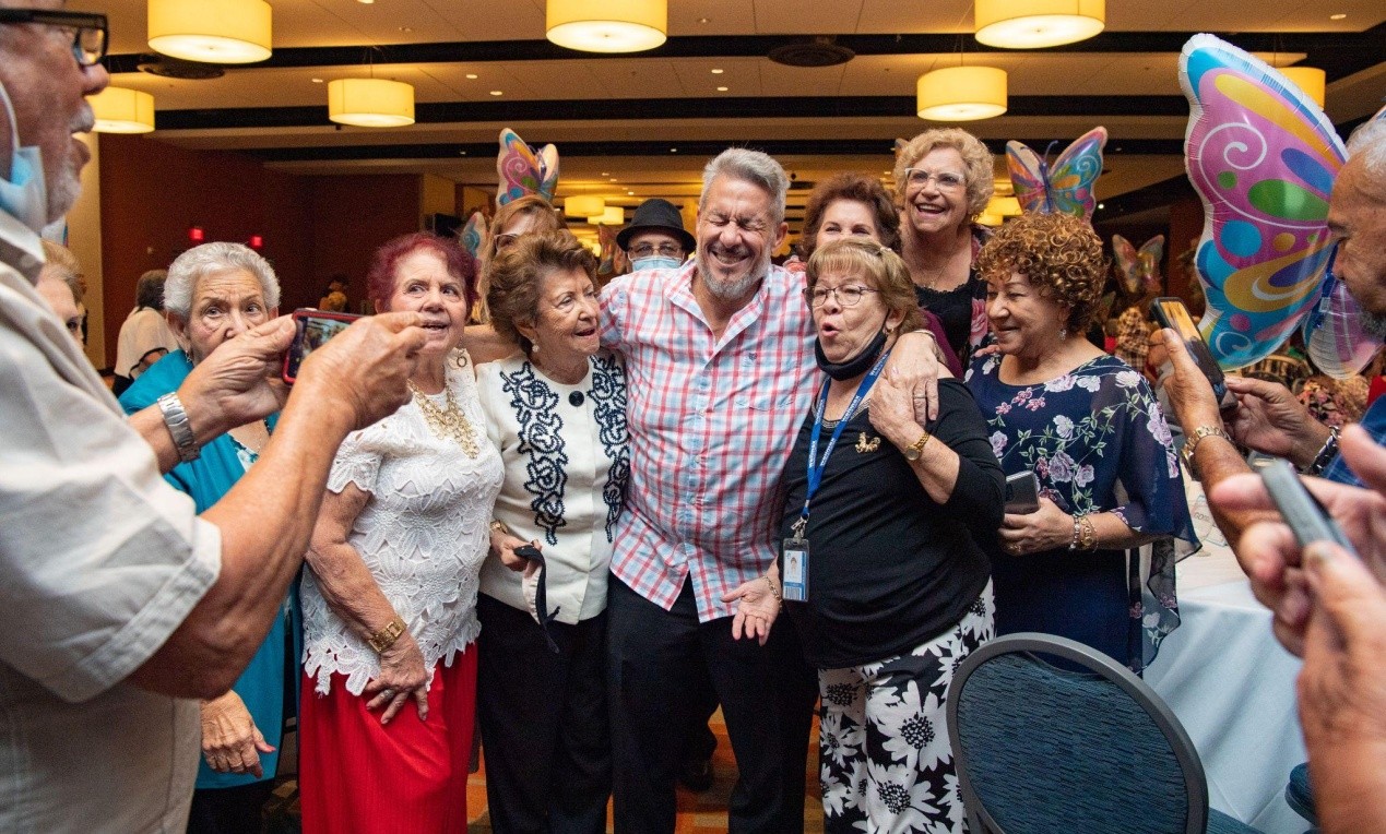A group of seniors attending the event poses with Chairman Pepe Diaz.