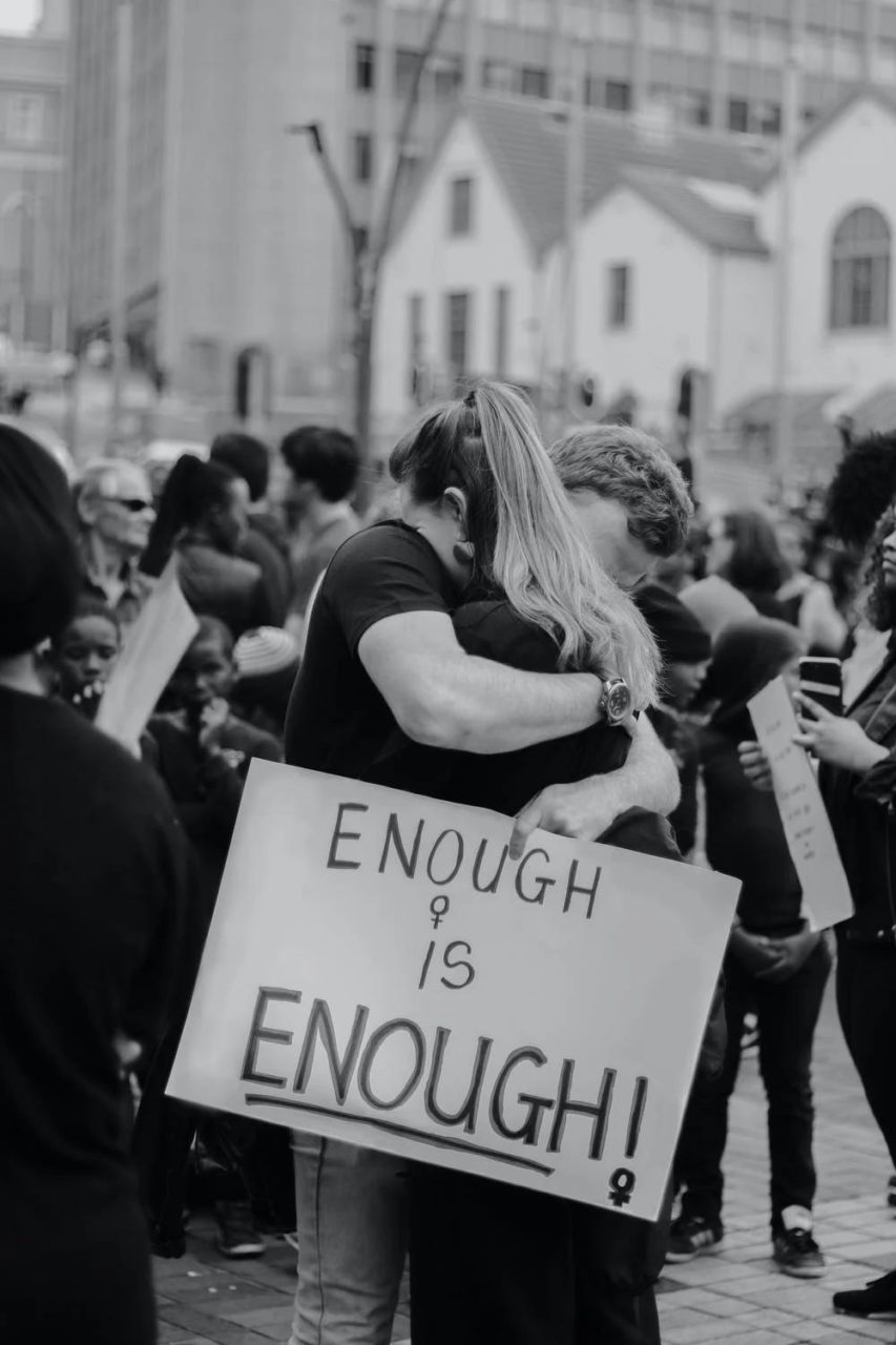 Two people protesting against anti-abortion decisions.