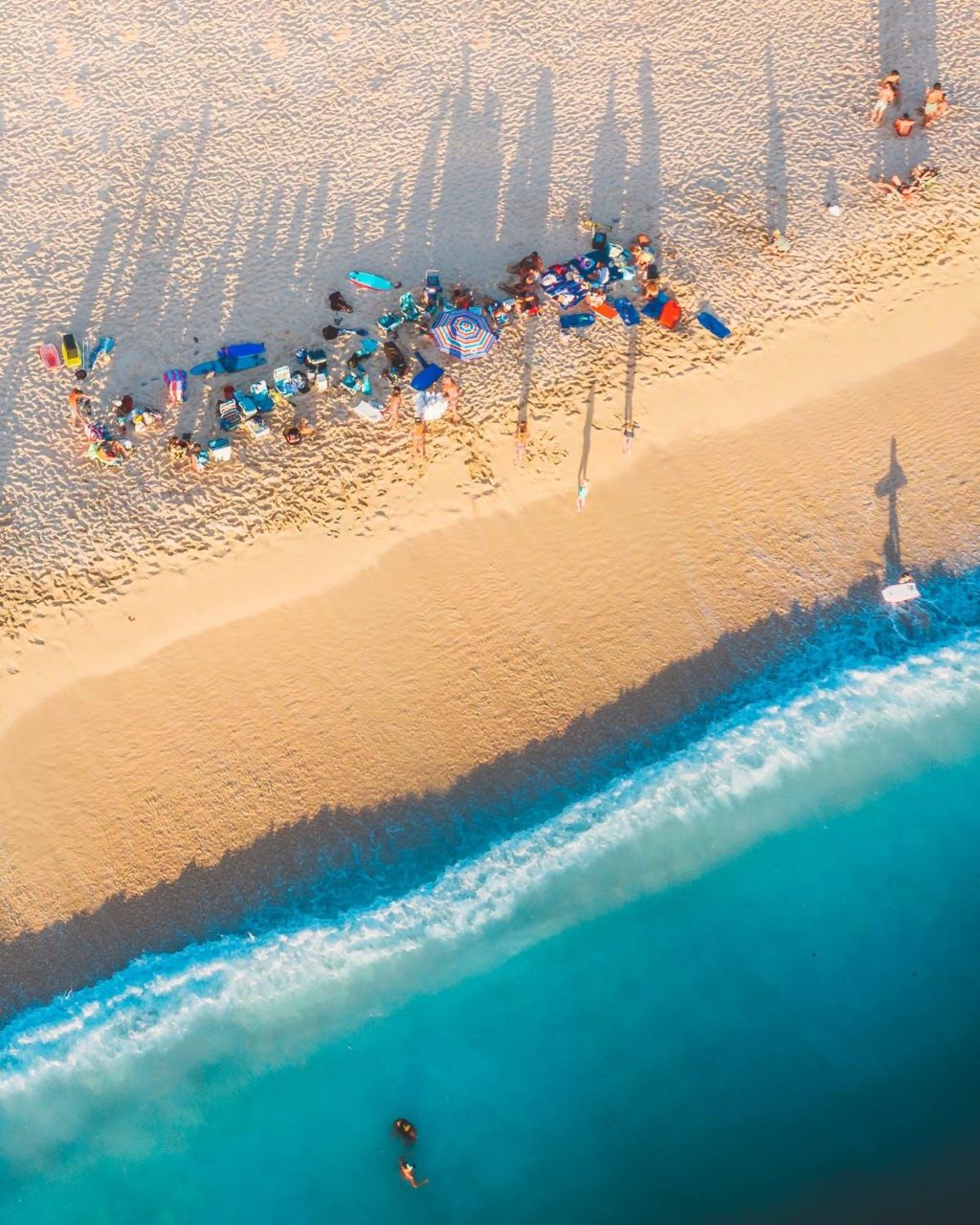 Tourists crowded at a beach in Miami.