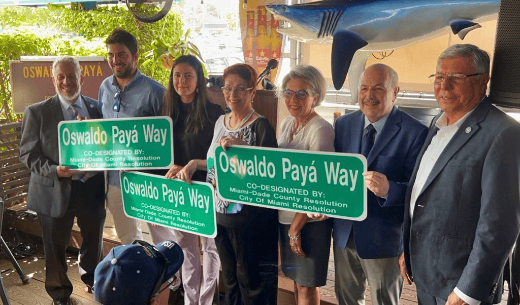 Group with Oswaldo Paya Way sign