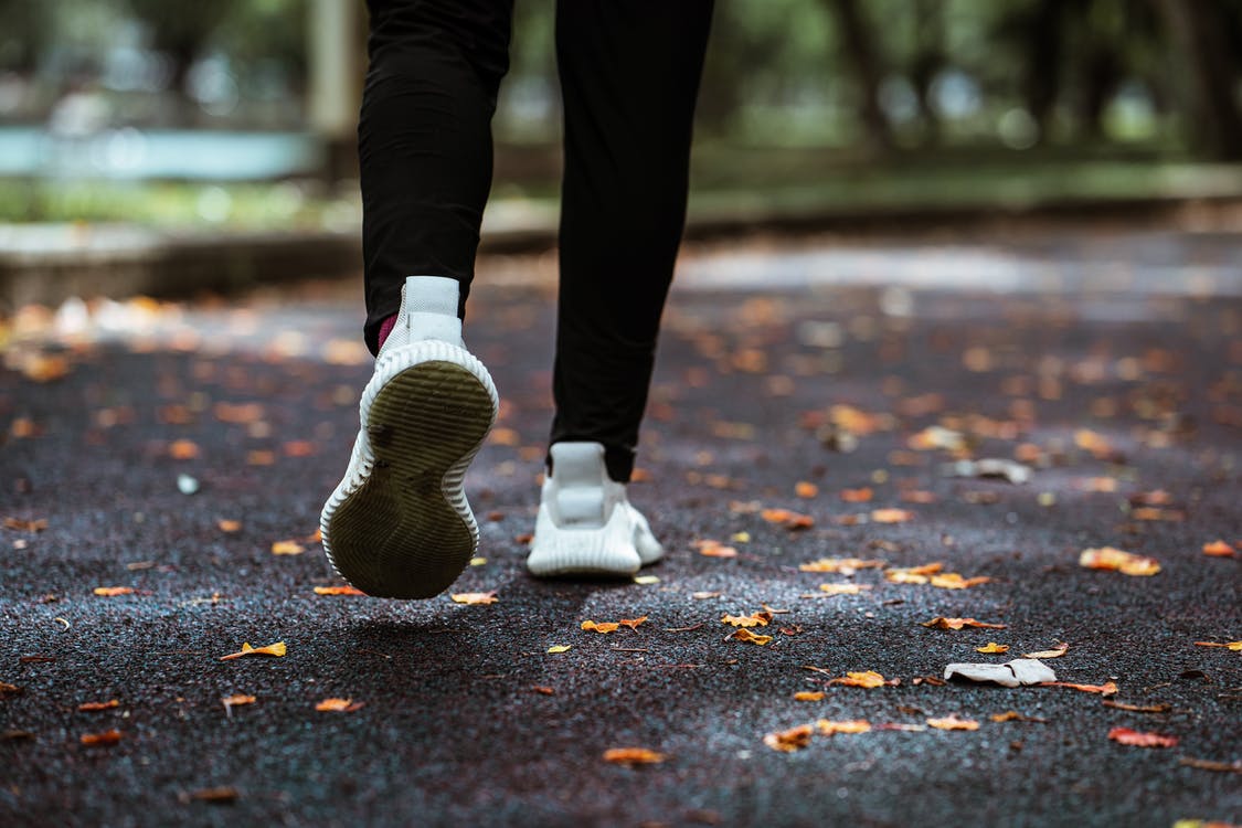 a woman walking on a road