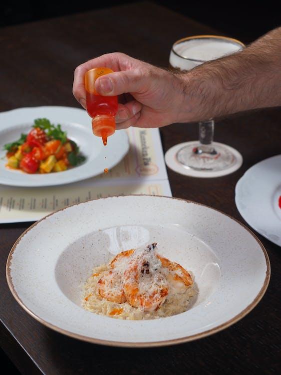 A chef serving delicious seafood dishes