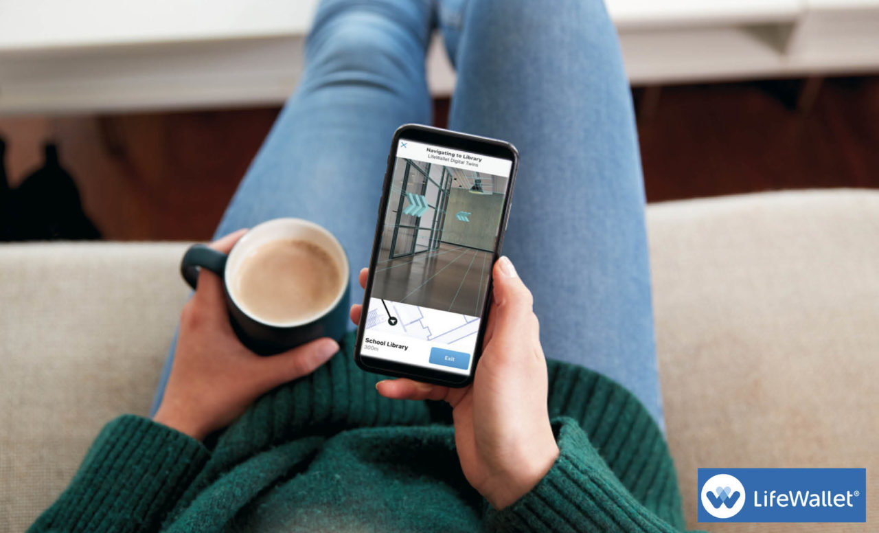 LifeWallet app on the screen of a man holding a cell phone