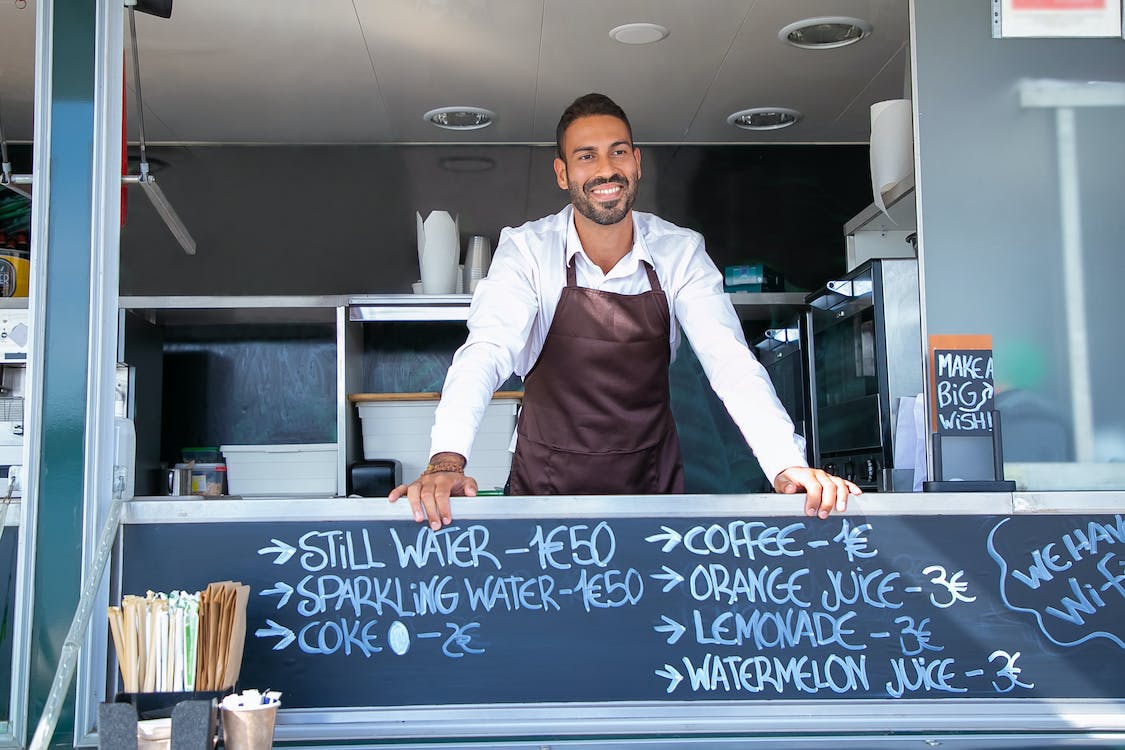 A person standing in a food truck