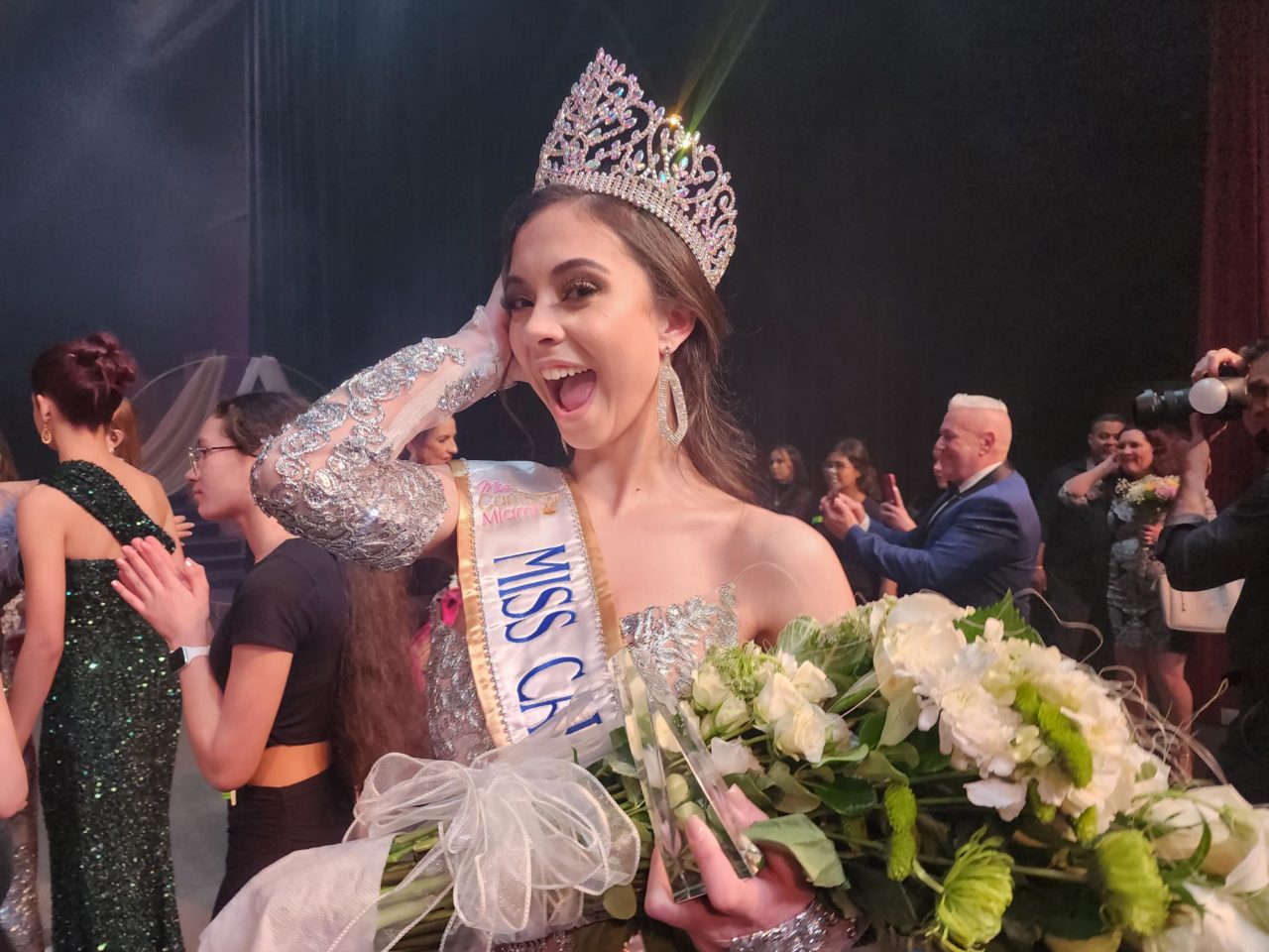 Daylyn Rodriguez standing with a crown