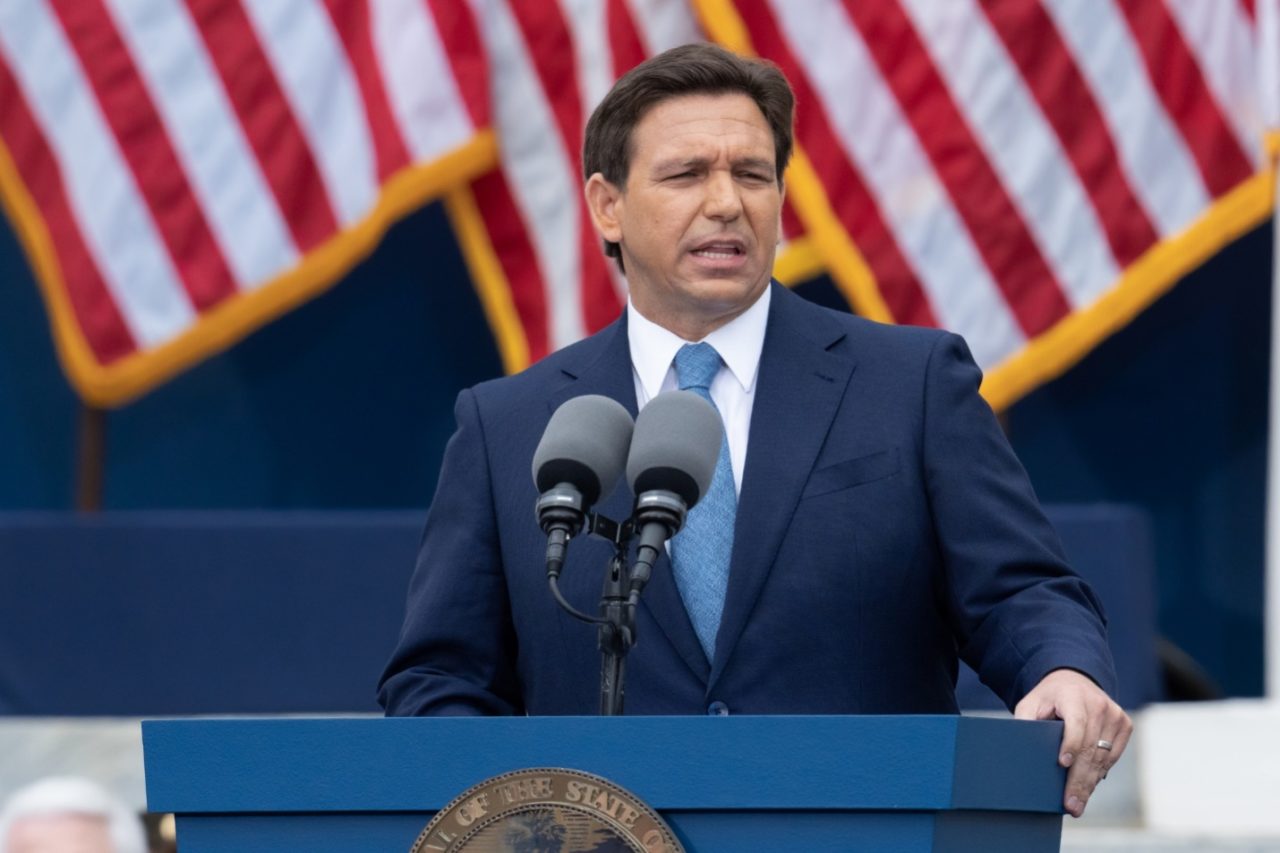 Governor Ron DeSantis standing at a podium