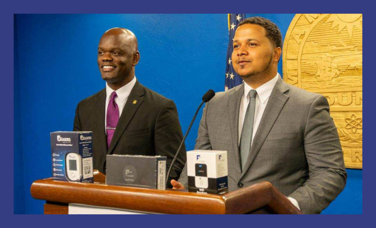 Commissioner Kione McGhee and Freddy Figgers of the Figgers Foundation