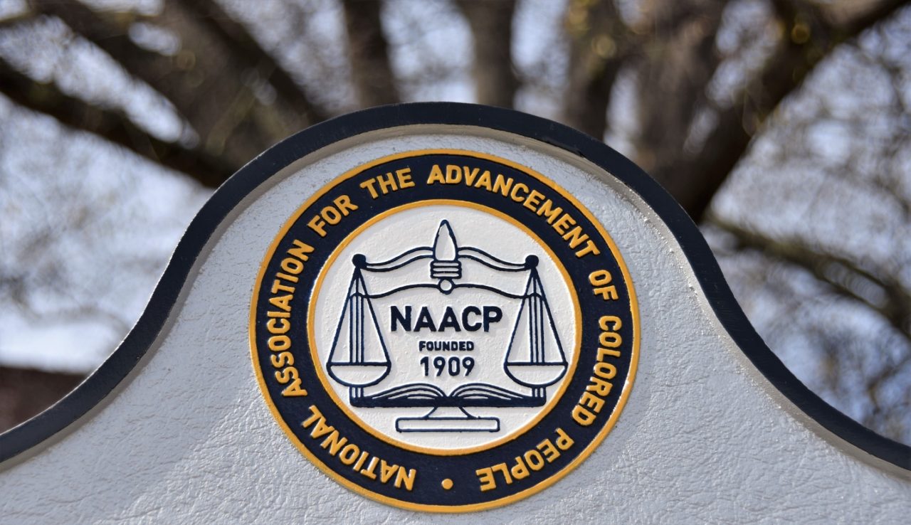 The NAACP logo imprinted on a wall