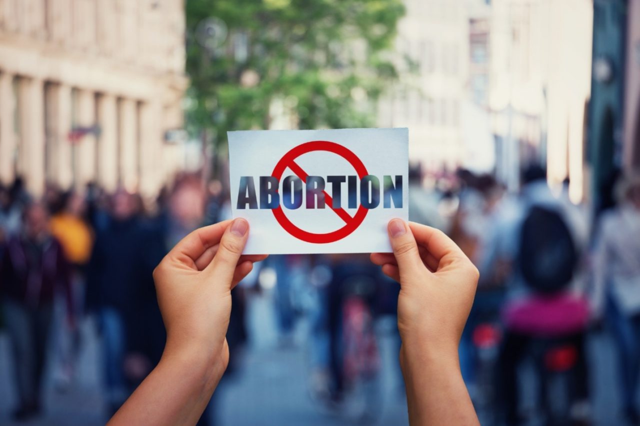 A placard depicting an abortion ban
