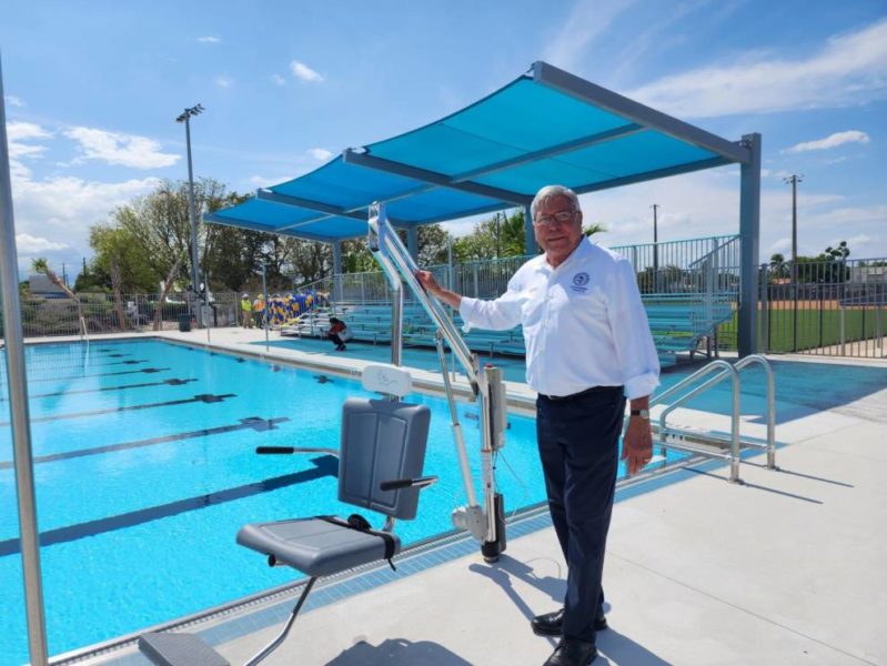 Manolo Reyes in front of swimming pool