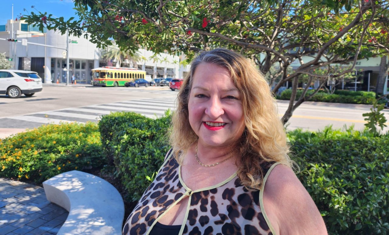 Tara Hoskins posing for picture in front of tree