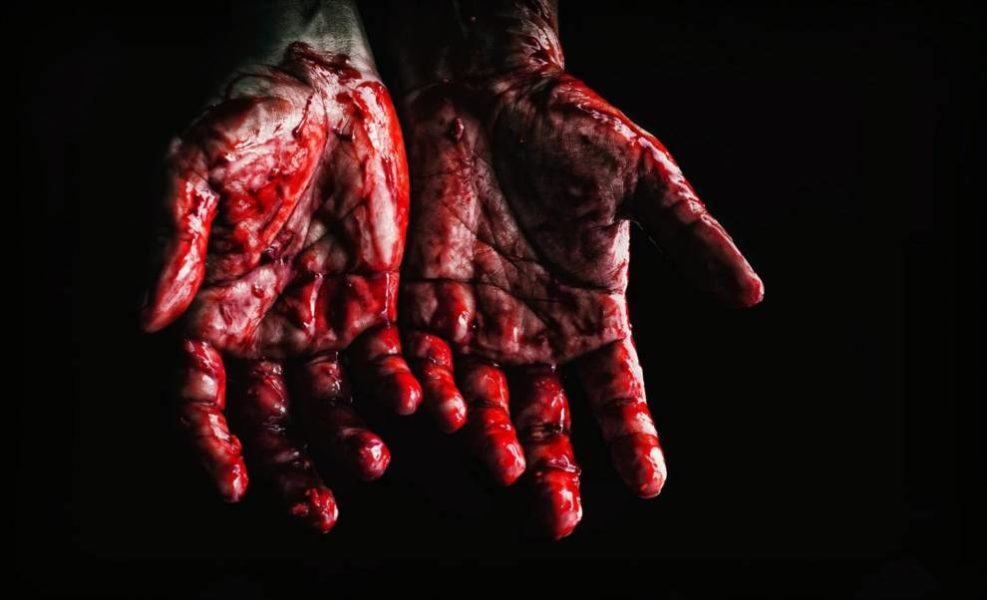 Hand covered with blood