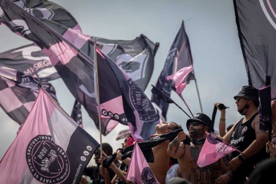 Inter Miami fans carrying club flags