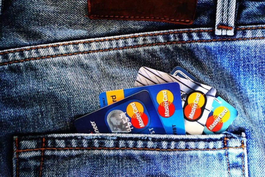 A bunch of Mastercards in a person’s pocket