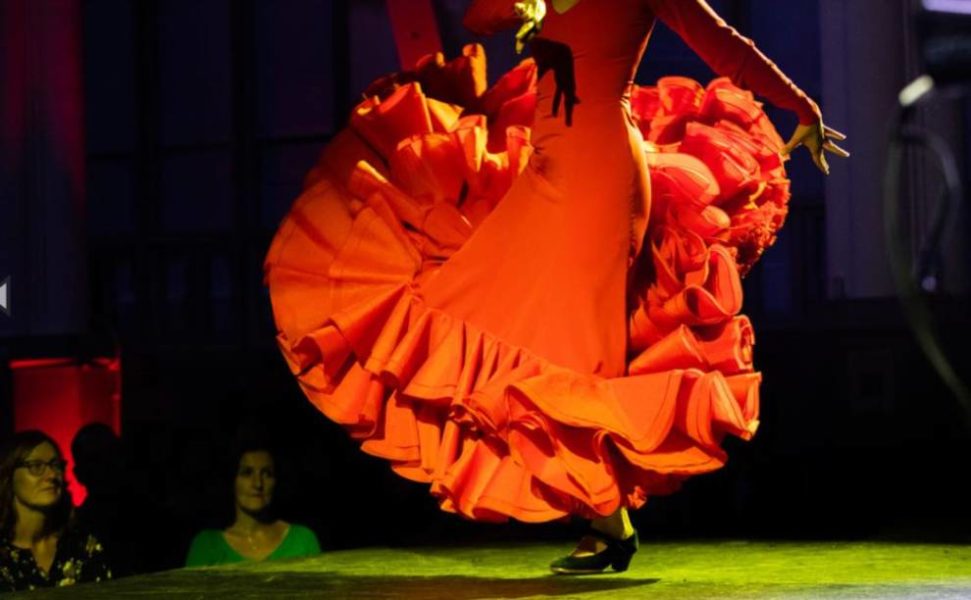A flamenco dancer performing on stage