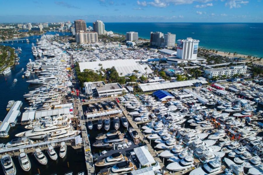 An aerial perspective showcases a bustling marina adorned with boats and buildings