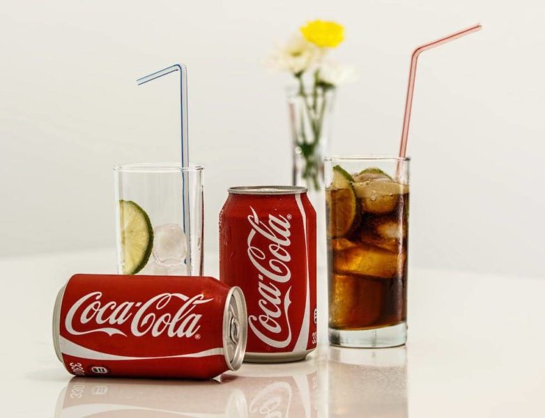 Cans of Coca-Cola and glasses