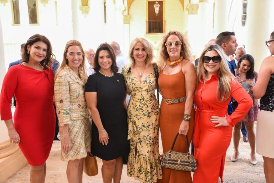 A group of women smiles for the camera at the event.