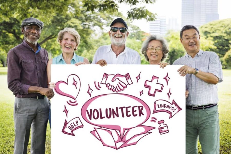 A sign in the park indicating volunteer opportunities