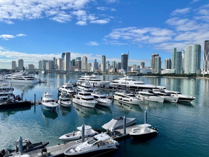 A beautiful sunset over a calm ocean with vibrant orange and pink hues reflecting on the water