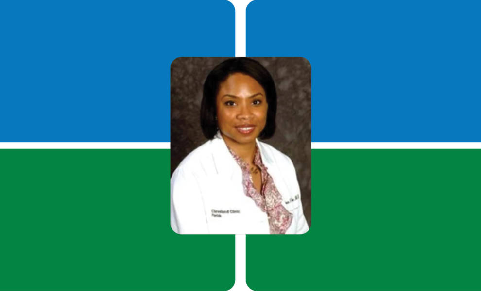 A woman in a white coat stands against a vibrant green and blue background.