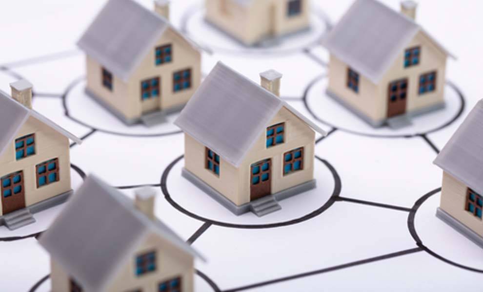 A network of small interconnected houses, creating a charming village scene