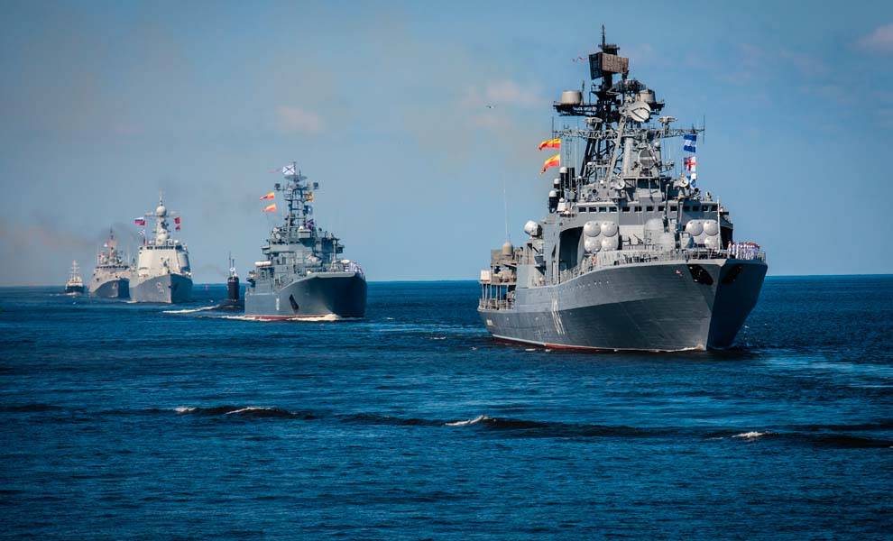 Russian navy ships sailing in the sea, showcasing military power and maritime strength.