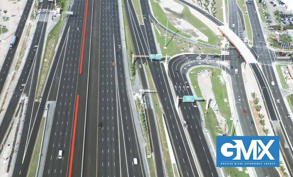 Aerial view of a busy GMX highway with cars and trucks driving on multiple lanes.