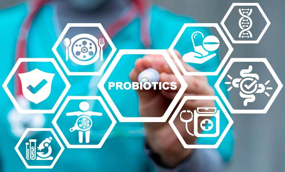 Una imagen colorida que muestra varios tipos de alimentos ricos en probióticos como yogur, kimchi y chucrut con el texto "los probióticos son los nuevos superalimentos".