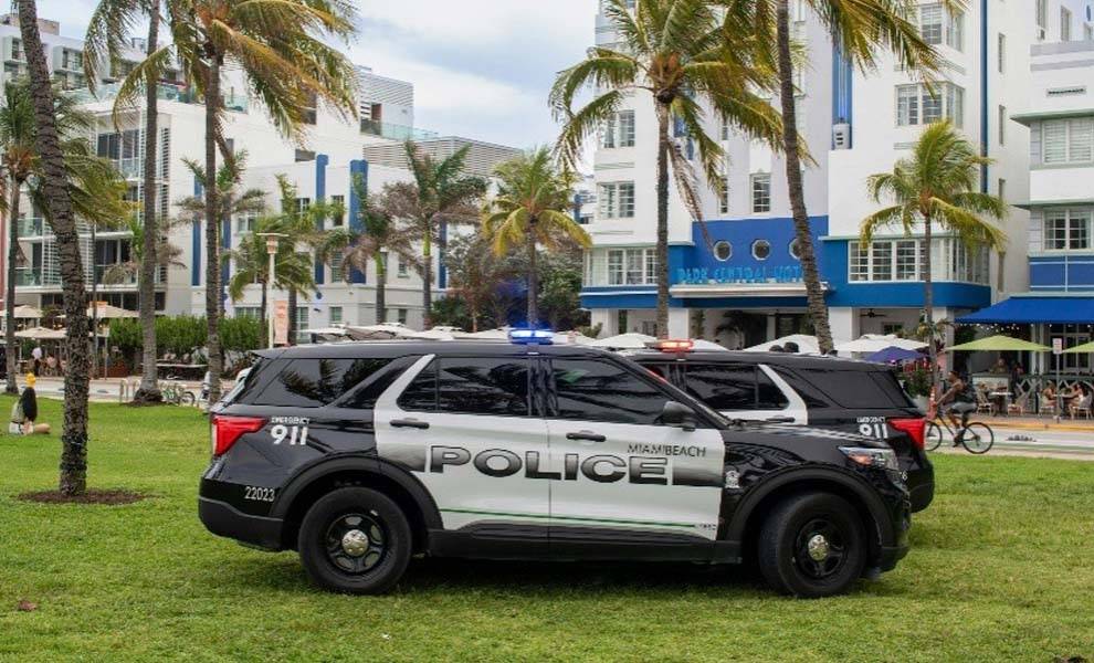 Police cars parked in front of a building.