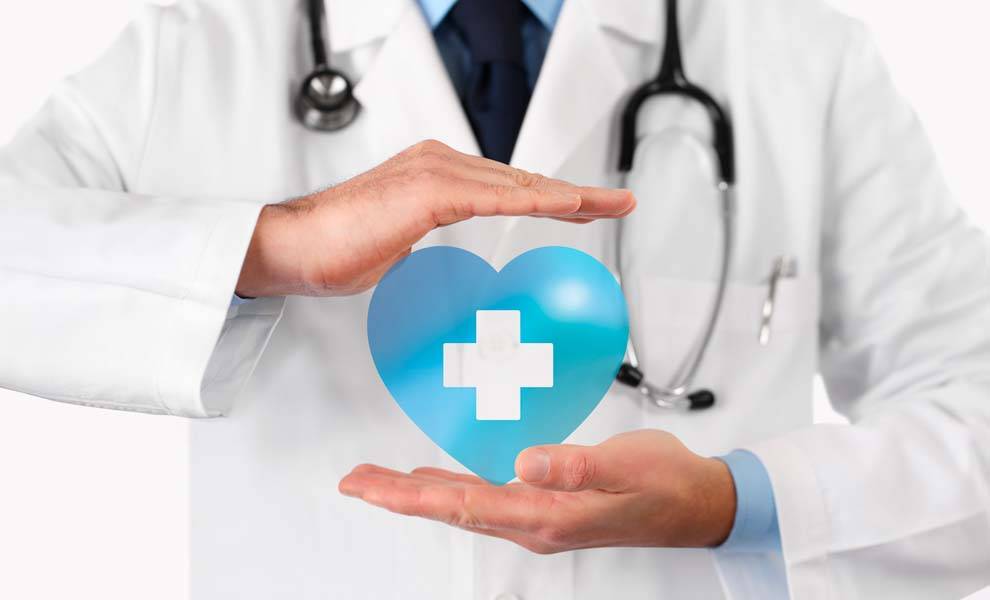 A doctor holding a heart-shaped medical symbol.