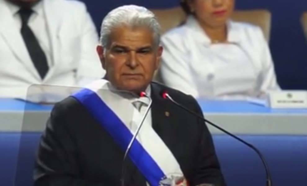 President of Panama in suit at podium.