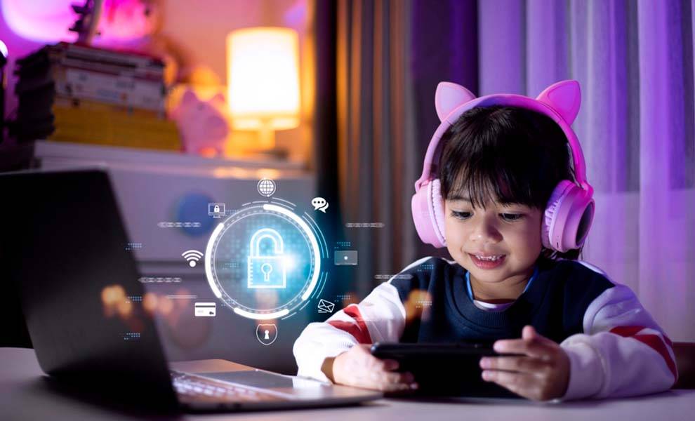 A child with headphones focused on playing a game on a laptop.