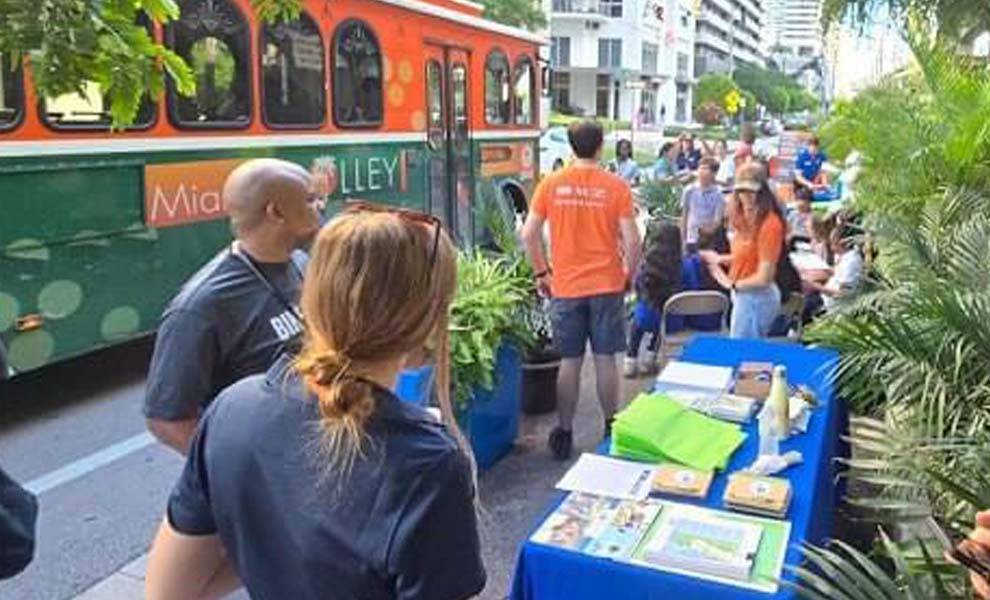 A group of people gathered at the Park(ing) Day in Miami.