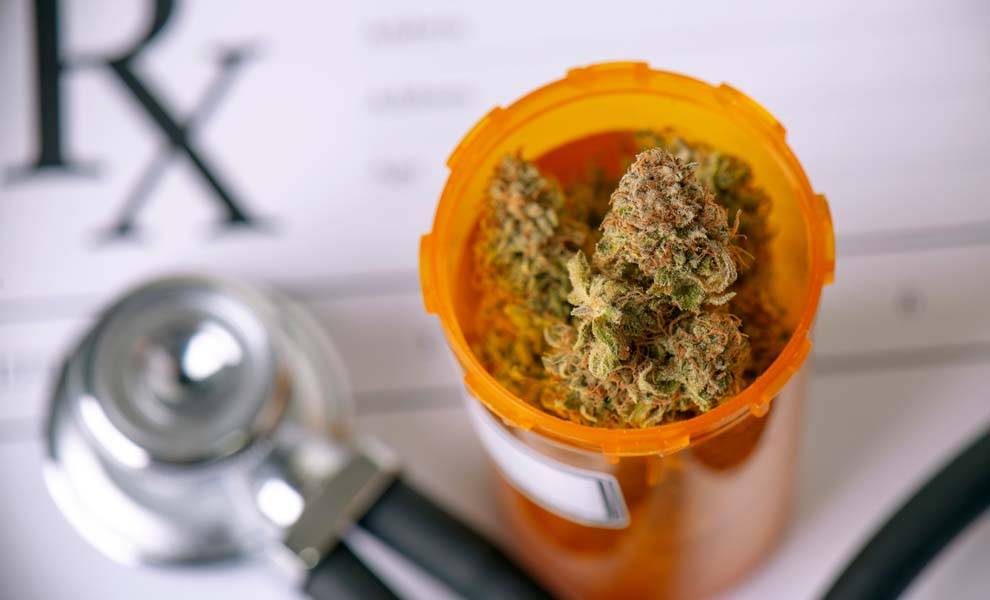 A prescription for marijuana with a bottle holding cannabis.