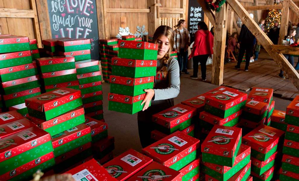 People packing boxes of gifts for Operation Christmas Child.