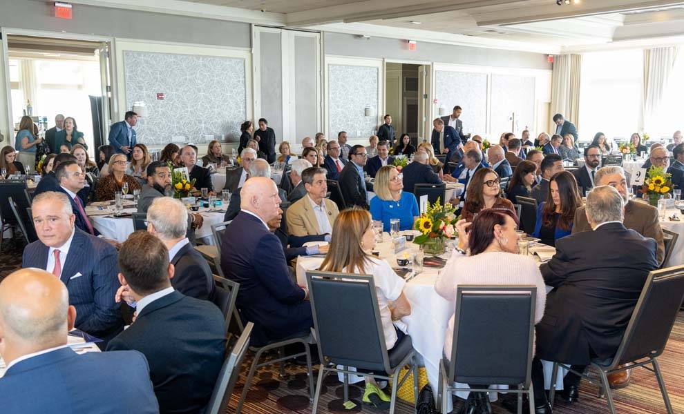 A large group of individuals seated at tables at the FACE Excellence Awards Luncheon.