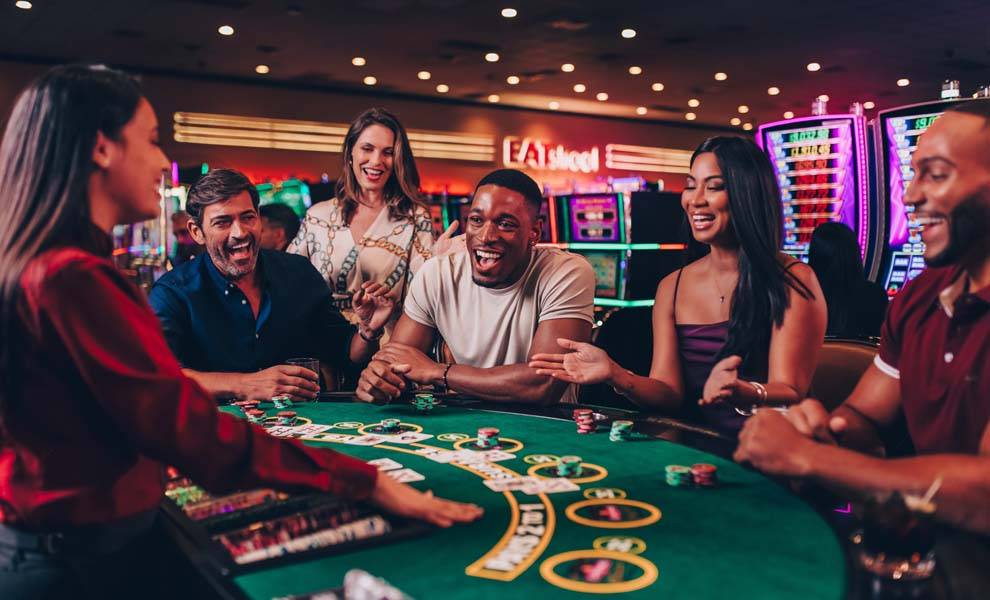 A group of people at Seminole Classic Casino playing table games.