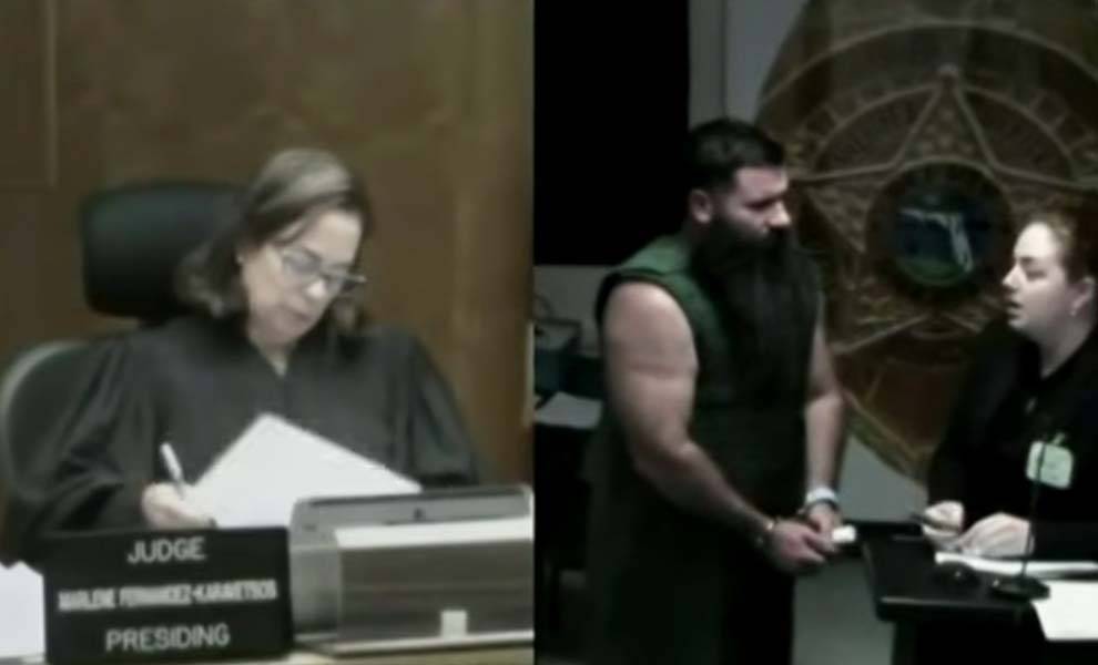 A judge presides over a courtroom while Adam Louis Anson stands before her, highlighting a legal proceeding in progress.