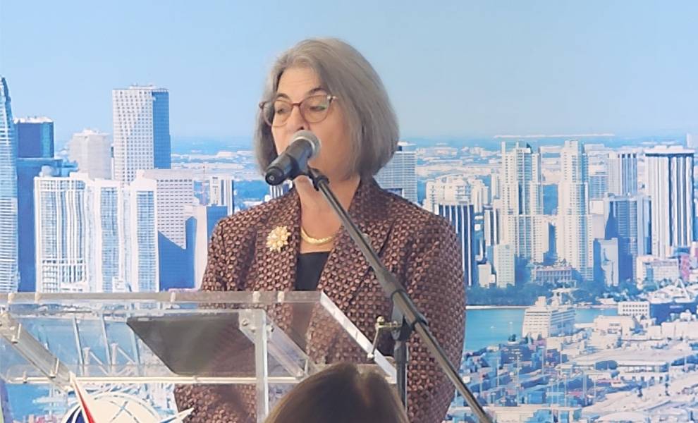 City of Miami Mayor Daniella Levine Cava speaks at a podium at a PortMiami event.