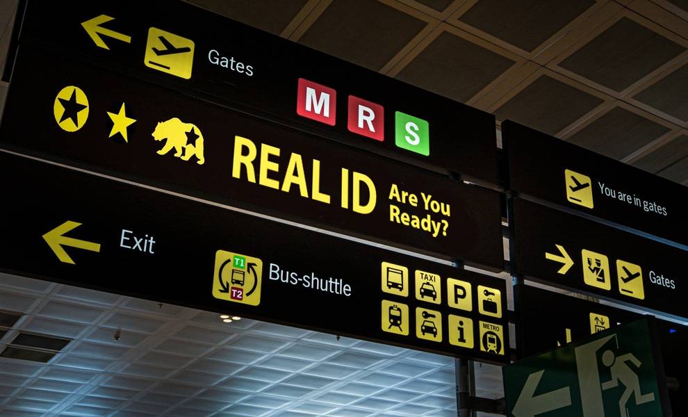 A sign displaying the words "Real ID" in bold letters against a plain background.