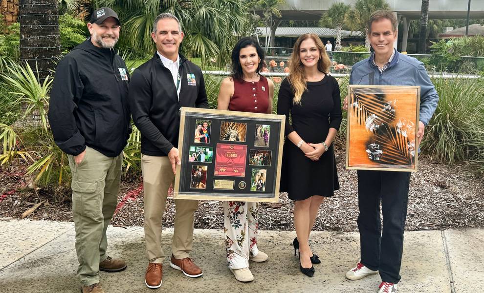 Ana VeigaMilton was presented a collage by staff at Zoo Miami.