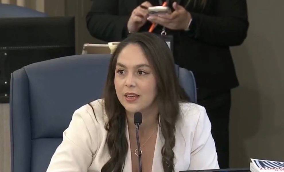 Commissioner Natalie Milian Orbis speaking at a meeting.