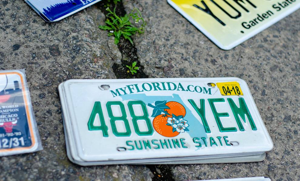 Florida license plate with yellow registration sticker.