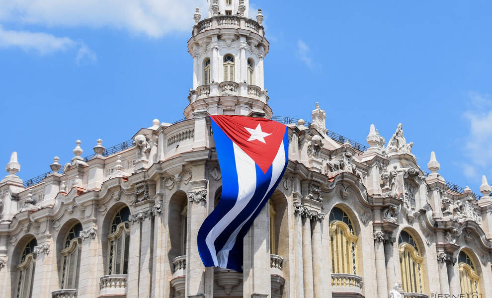 Cuban flag over Havana representing Cuba freedom and political change discussion.
