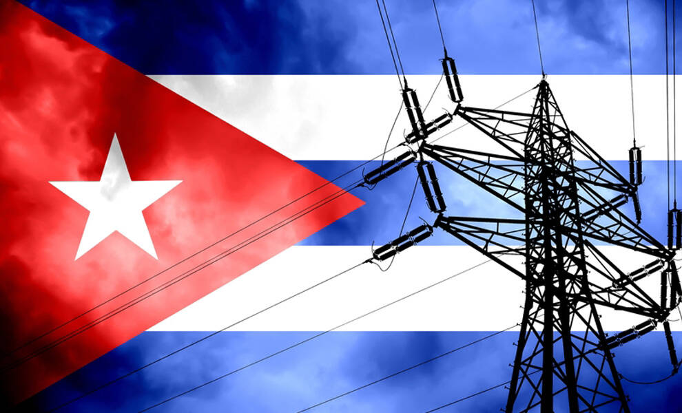 A silhouette of electrical transmission towers and power lines appears in front of the Cuban flag, symbolizing the country’s energy infrastructure and possible blackout.