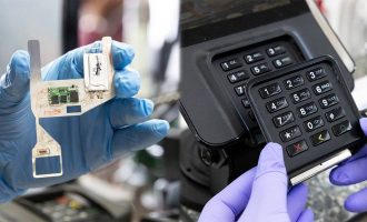A skimming device being removed from a keypad by the Secret Service.