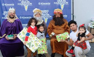 Children with gifts received at the Kiwanis of Little Havana Three Kings event.